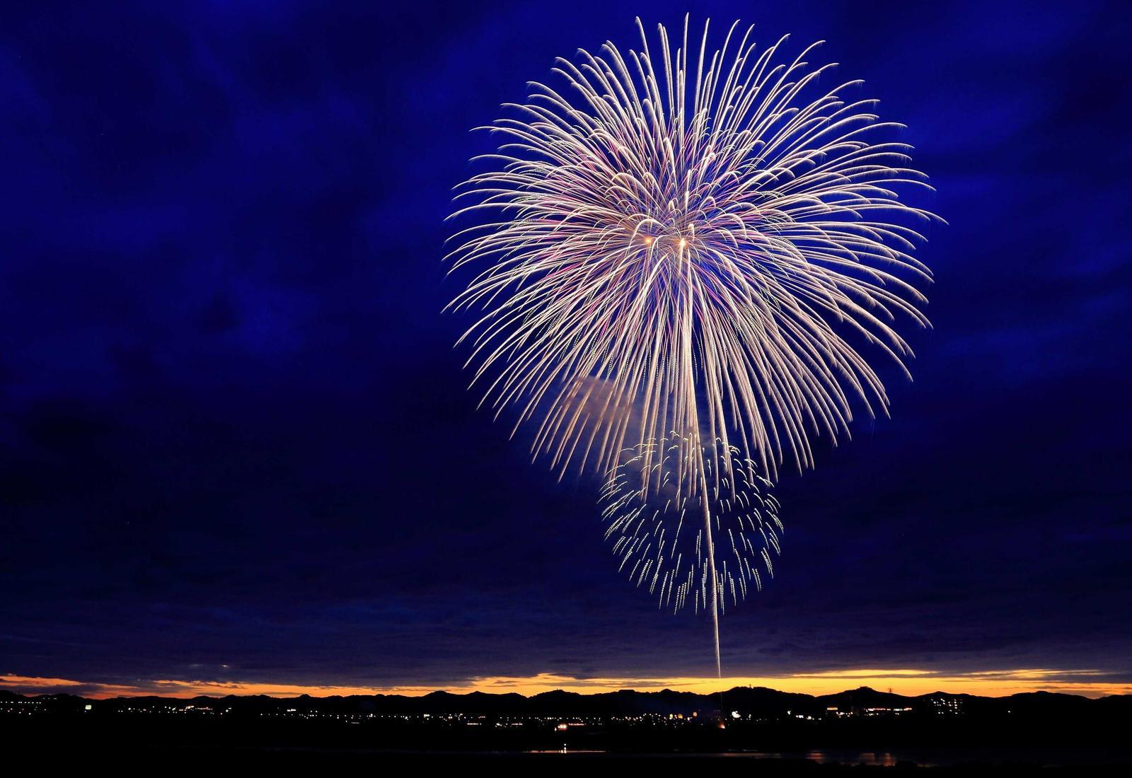 Fireworks over a city at night
