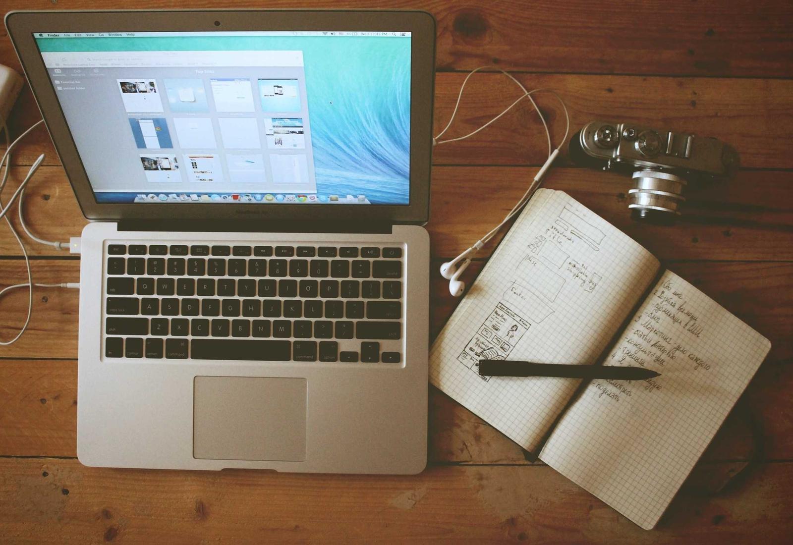 A laptop and an open notebook during a training session
